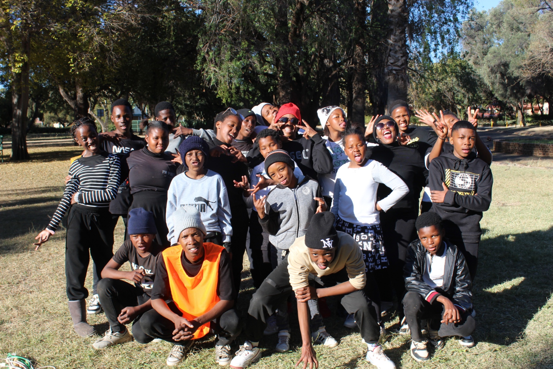 Group portrait of teens and youth at a Come N Play outreach in a Kimberley park