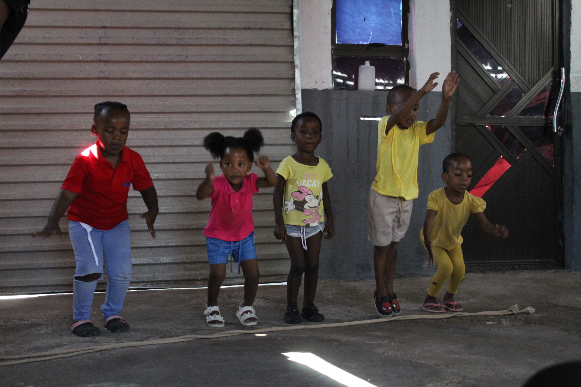 Toddlers dancing together during a Come N Play workshop