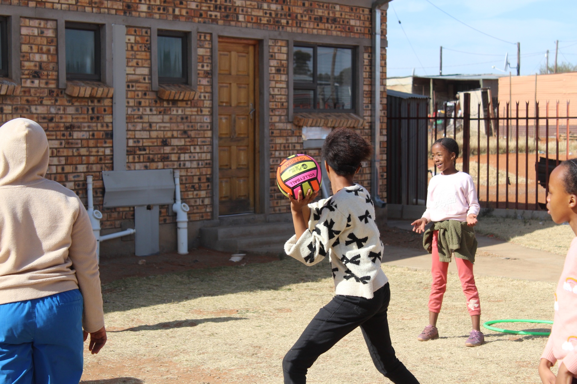 Children passing a volleyball during a sports session